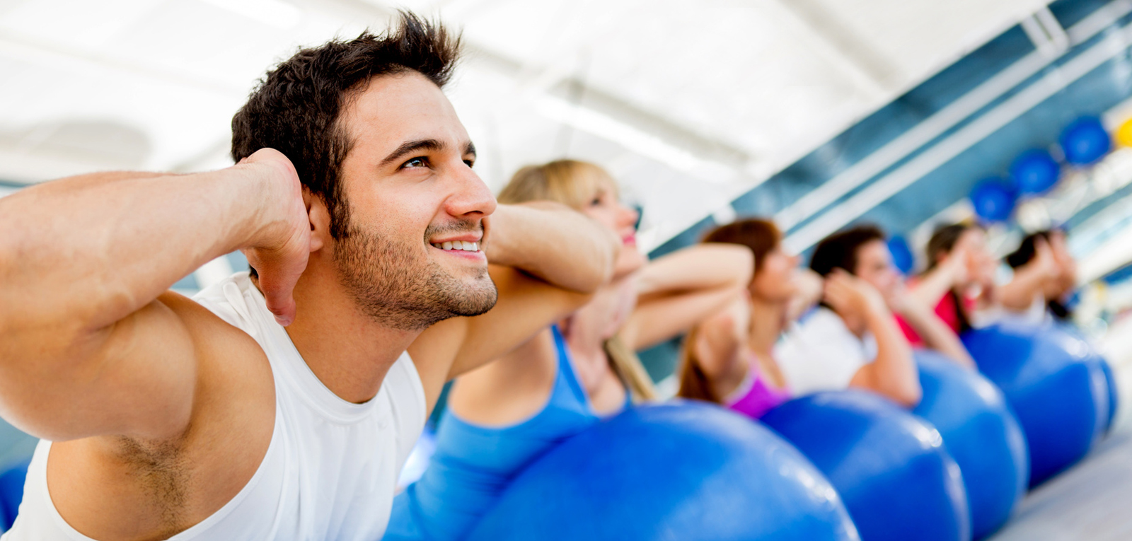 Group of people exercising at the gym in a fitness class